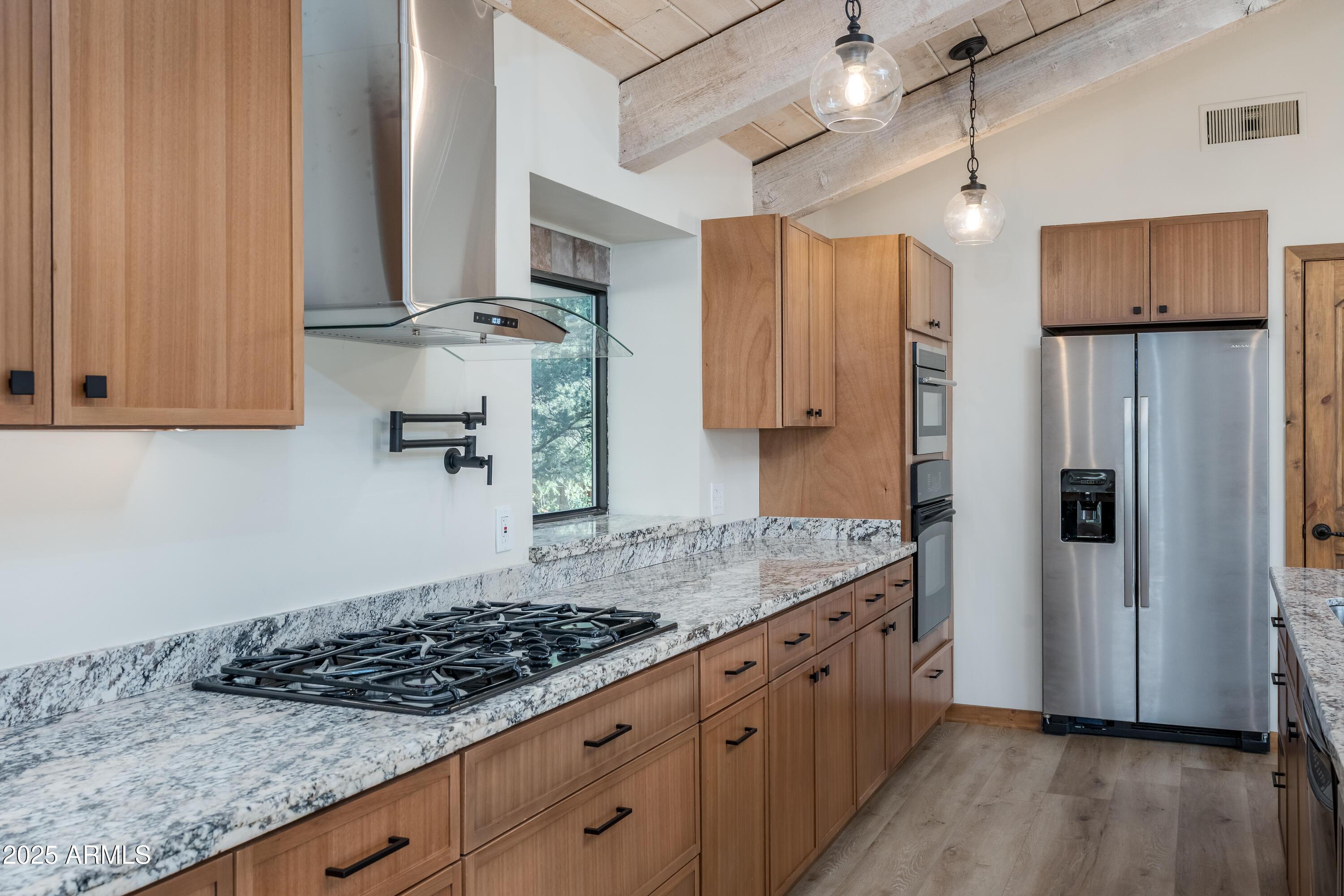 1050 Lee Mountain Road Sedona, AZ 86351 - Photo 34 of 78 a kitchen with stainless steel appliances granite countertop a stove a refrigerator and a sink