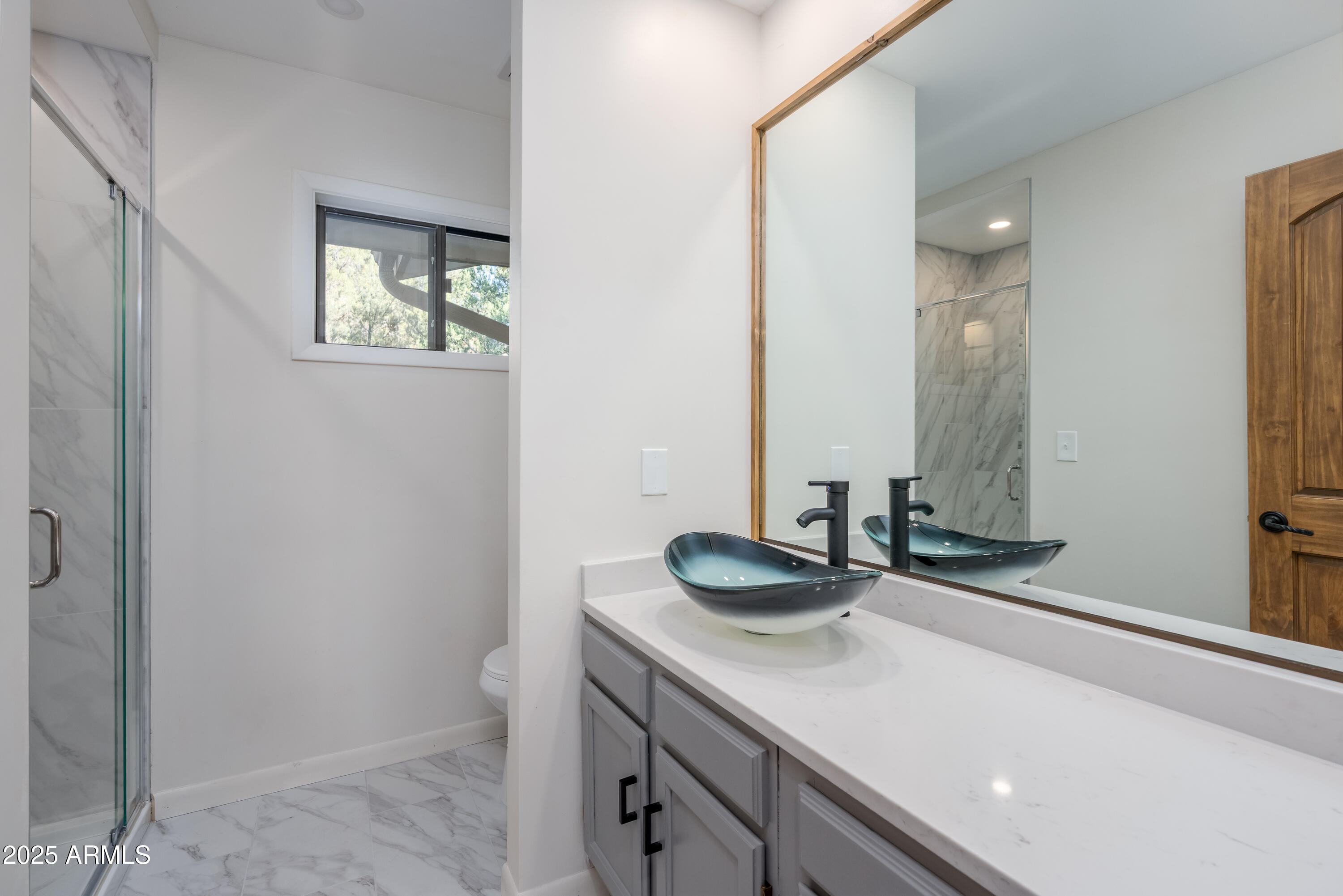 1050 Lee Mountain Road Sedona, AZ 86351 - Photo 35 of 80 a bathroom with a sink and a mirror