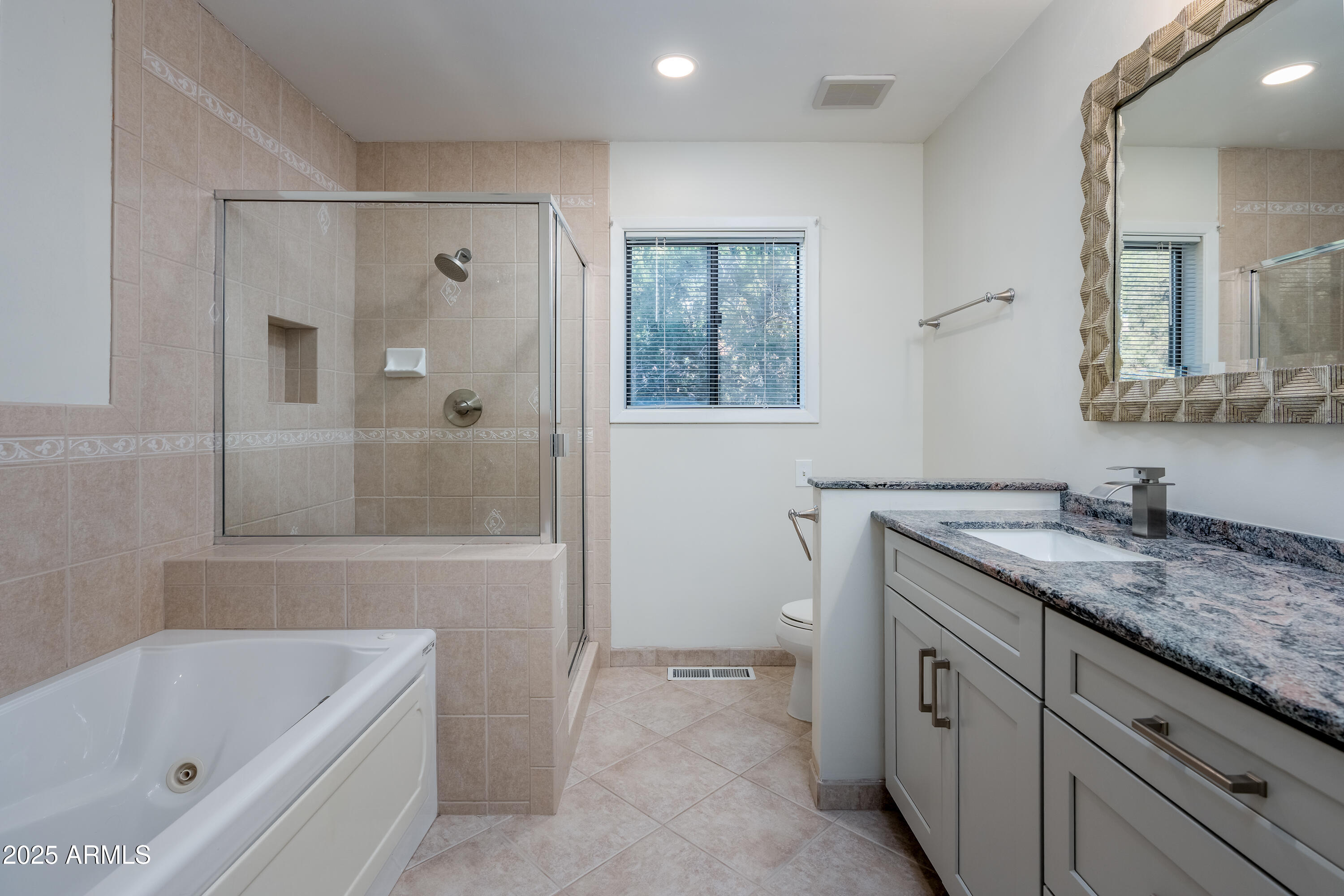 1050 Lee Mountain Road Sedona, AZ 86351 - Photo 38 of 80 a bathroom with a granite countertop sink a toilet and shower