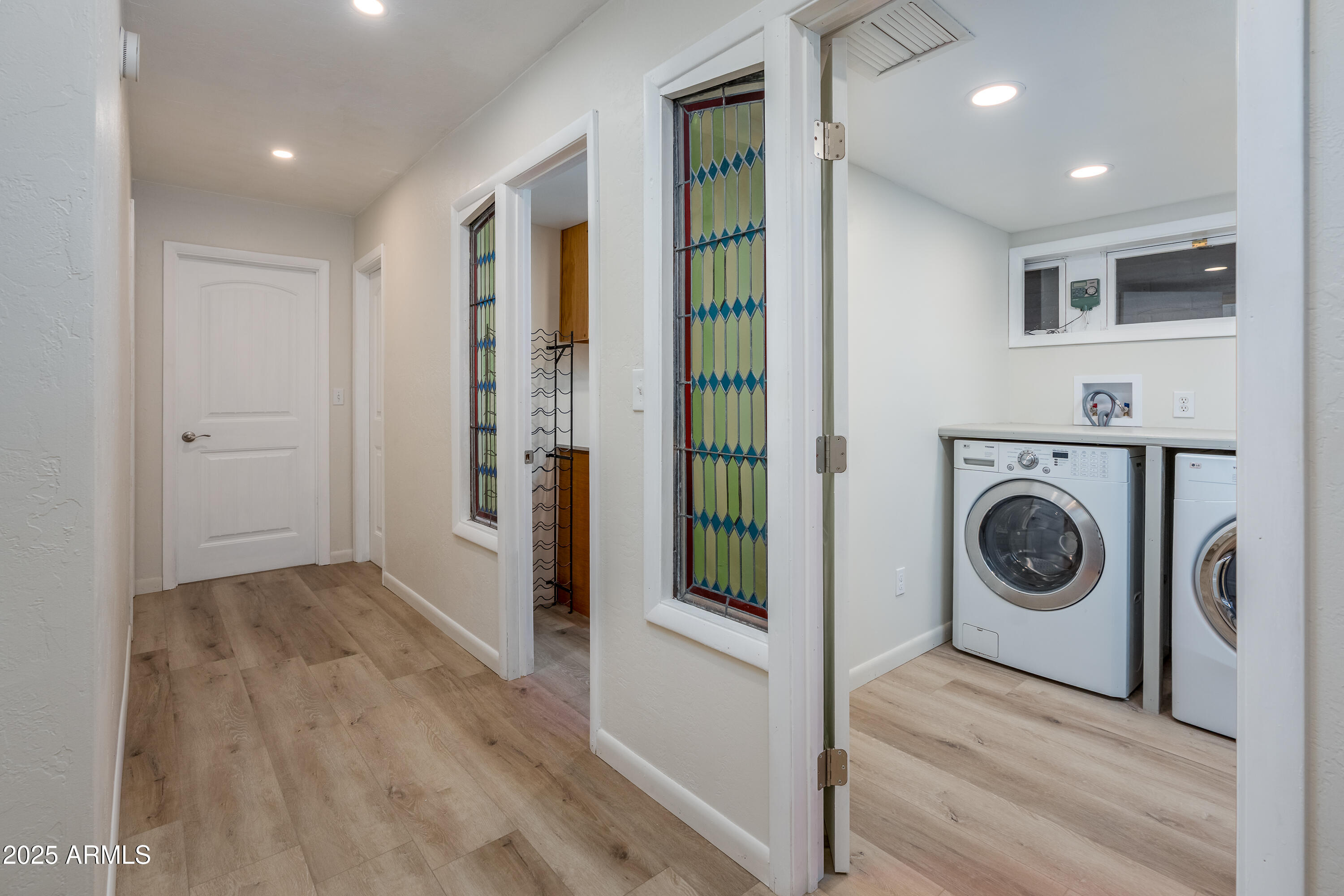 1050 Lee Mountain Road Sedona, AZ 86351 - Photo 42 of 78 a view of a hallway with washer and dryer