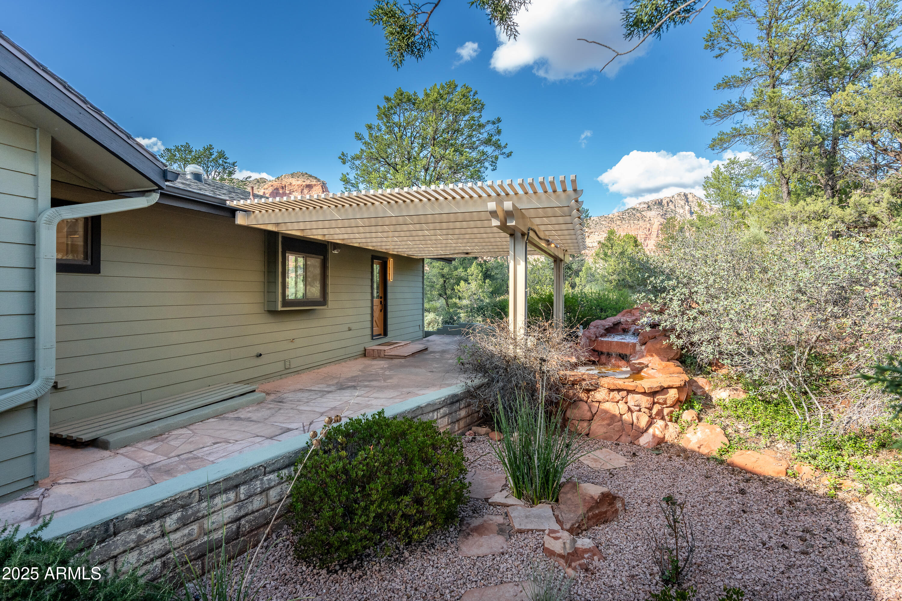 1050 Lee Mountain Road Sedona, AZ 86351 - Photo 53 of 78 a view of a backyard with plants and outdoor seating