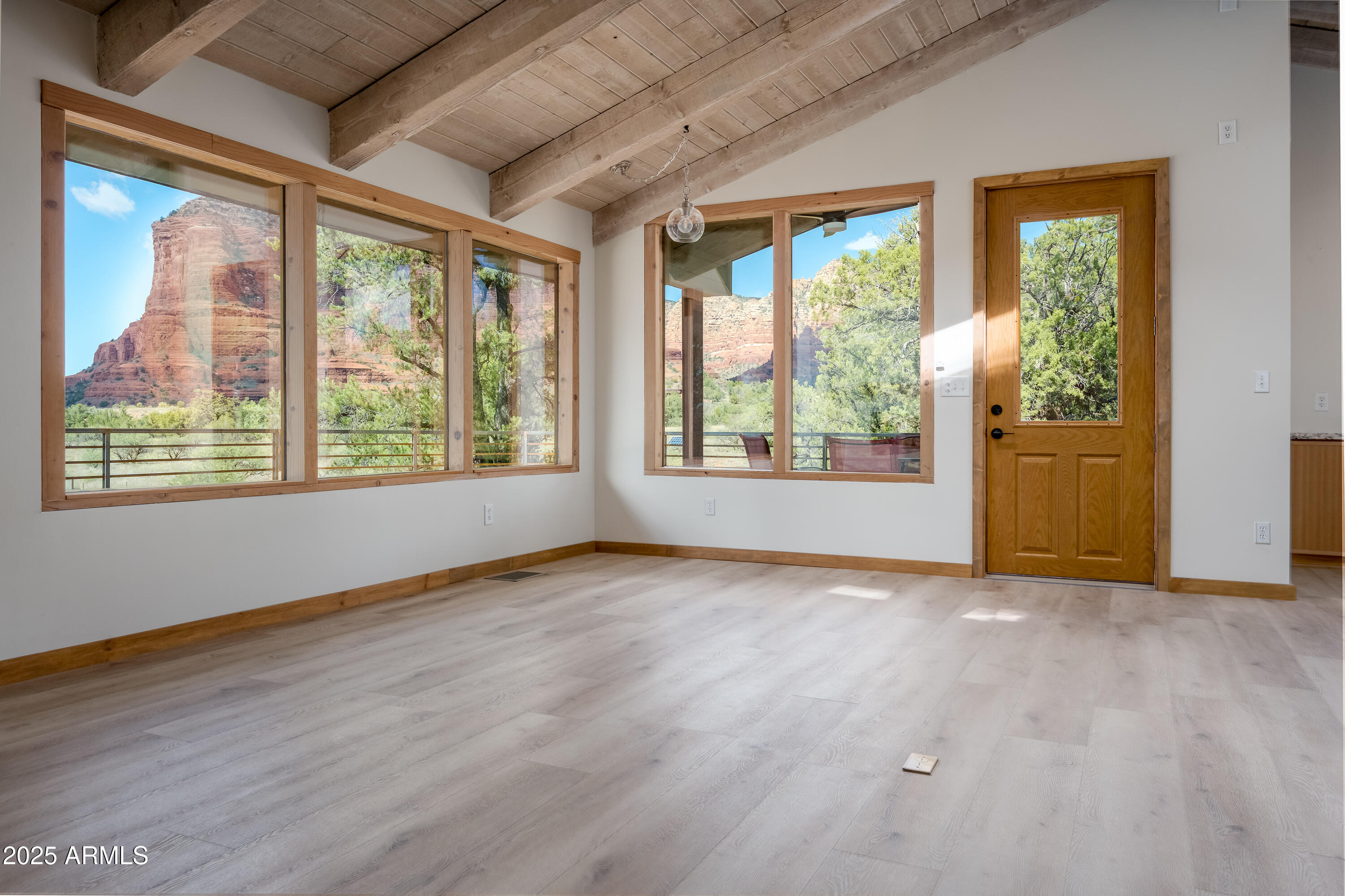 1050 Lee Mountain Road Sedona, AZ 86351 - Photo 59 of 78 a view of an empty room with wooden floor and a window