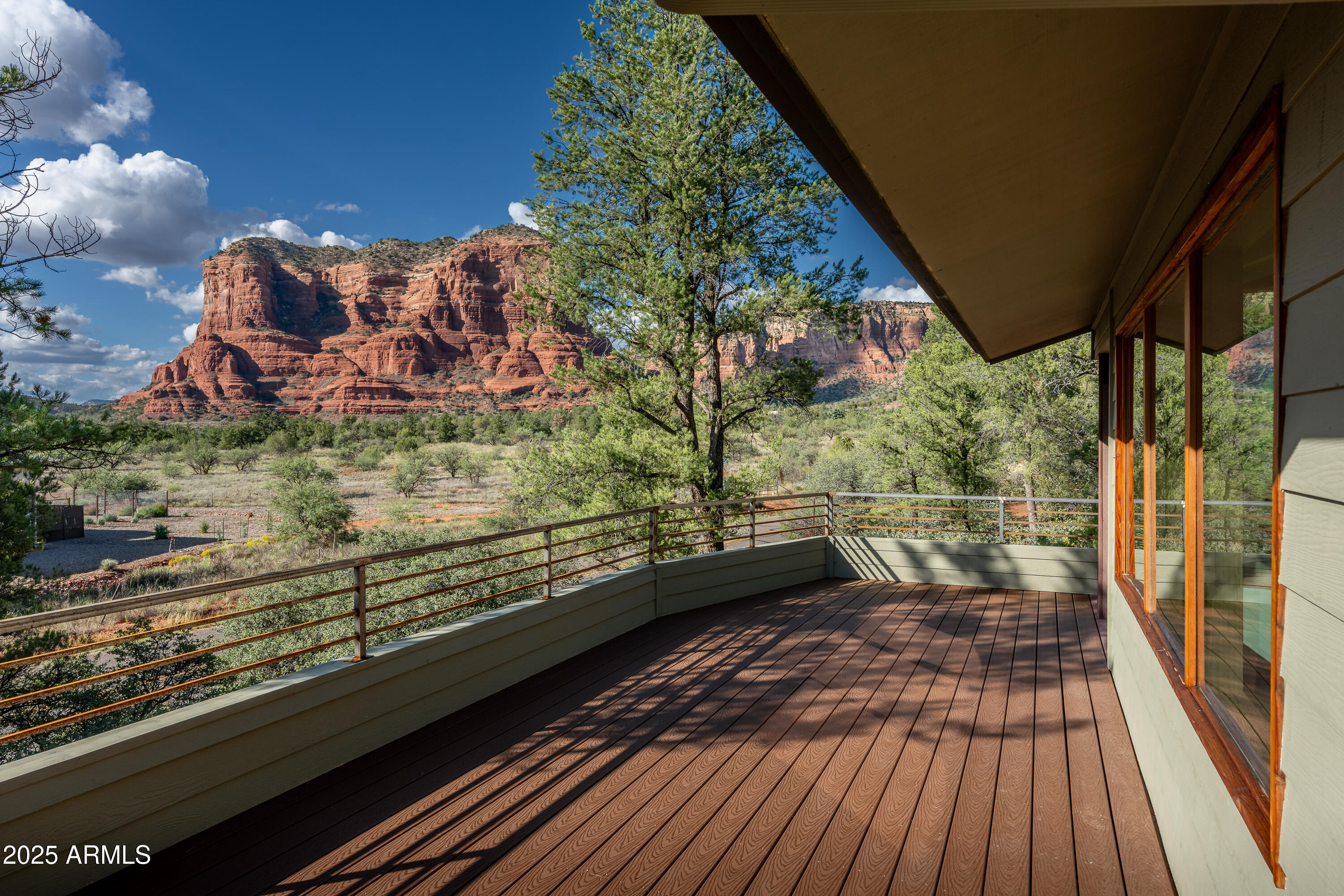 1050 Lee Mountain Road Sedona, AZ 86351 - Photo 62 of 80 a view of a balcony with wooden floor