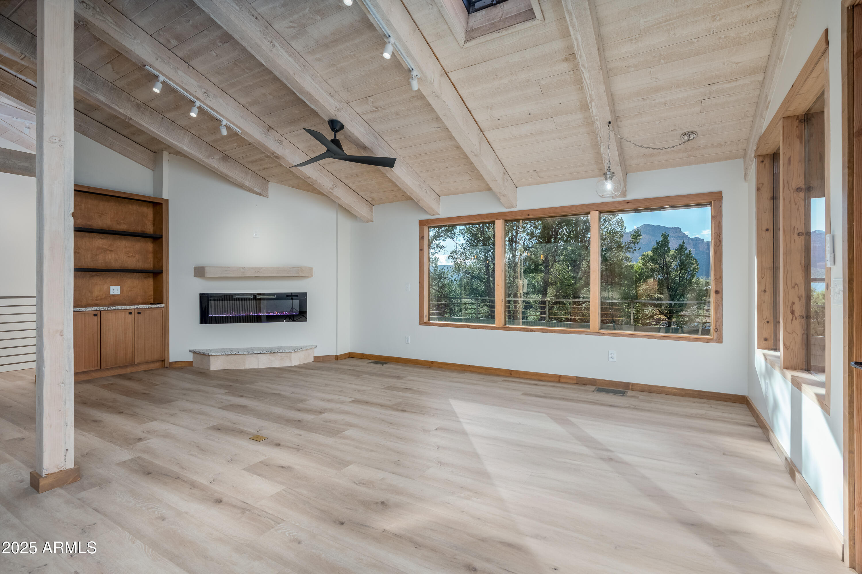 1050 Lee Mountain Road Sedona, AZ 86351 - Photo 71 of 80 a view of an empty room with a window and a kitchen