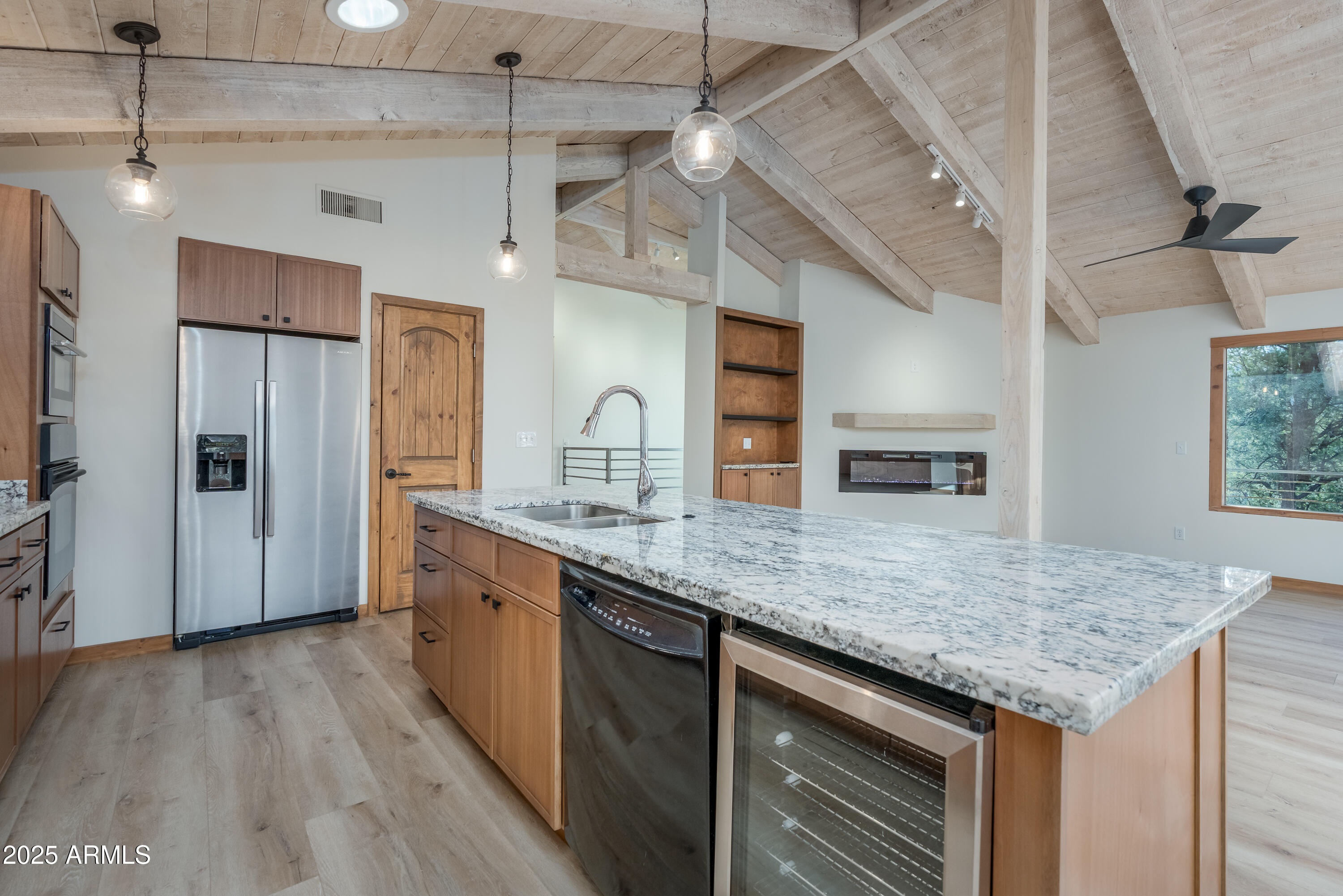 1050 Lee Mountain Road Sedona, AZ 86351 - Photo 75 of 78 a kitchen with stainless steel appliances granite countertop hardwood floor sink stove and refrigerator