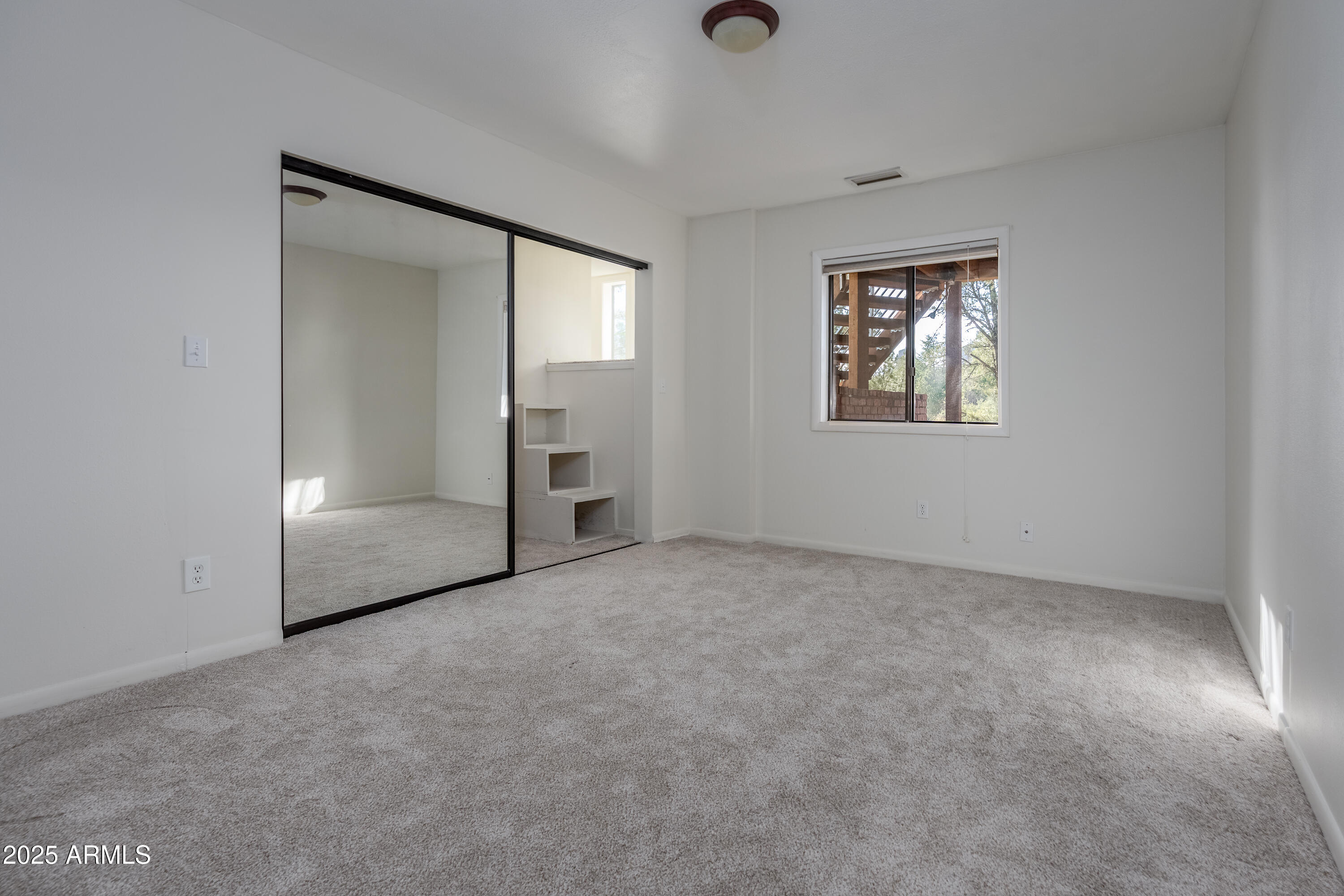 1050 Lee Mountain Road Sedona, AZ 86351 - Photo 78 of 78 an empty room with windows and closet