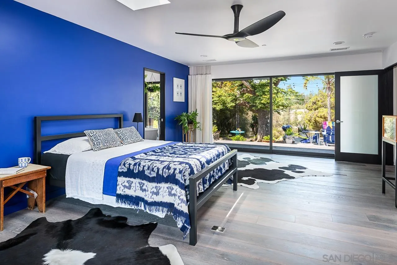 17436 Rancho Del Rio Rancho Santa Fe, CA 92067 - Photo 14 of 44 a bed sitting in a spacious bedroom next to a window