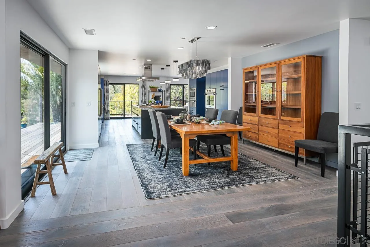 17436 Rancho Del Rio Rancho Santa Fe, CA 92067 - Photo 6 of 44 a living room with furniture a large window and wooden floor