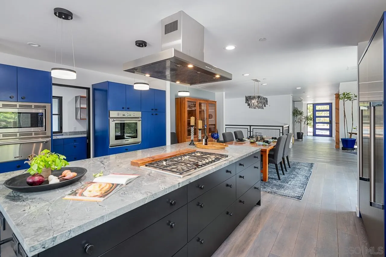 17436 Rancho Del Rio Rancho Santa Fe, CA 92067 - Photo 8 of 44 a kitchen with stainless steel appliances granite countertop a stove refrigerator and a sink