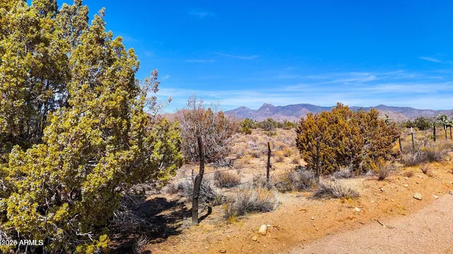 a sign that is sitting in the middle of a lake