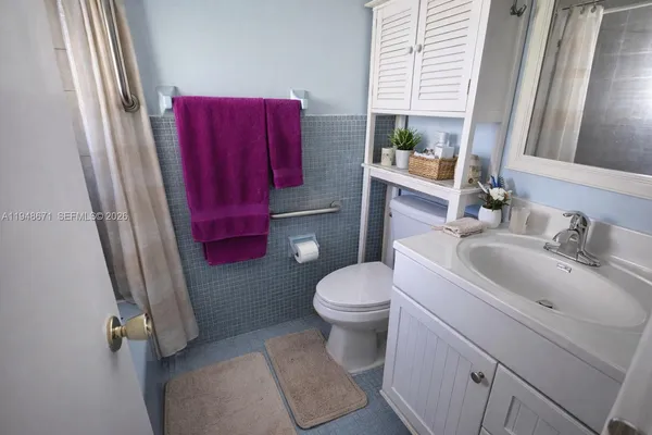a bathroom with a sink and toilet