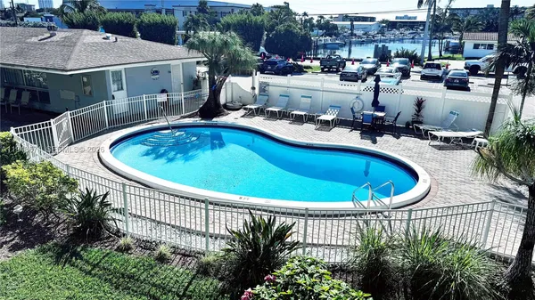a view of a swimming pool with a patio