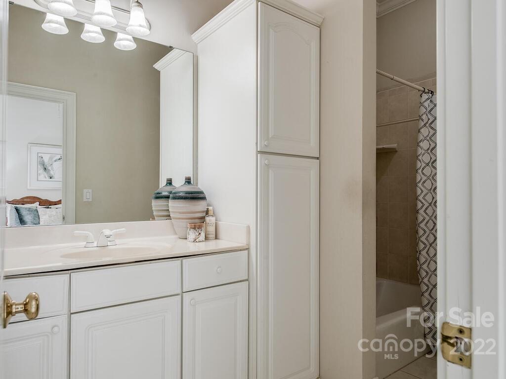 4101 High Ridge Road Charlotte, NC 28270 - Photo 15 of 38 a bathroom with a sink and a mirror