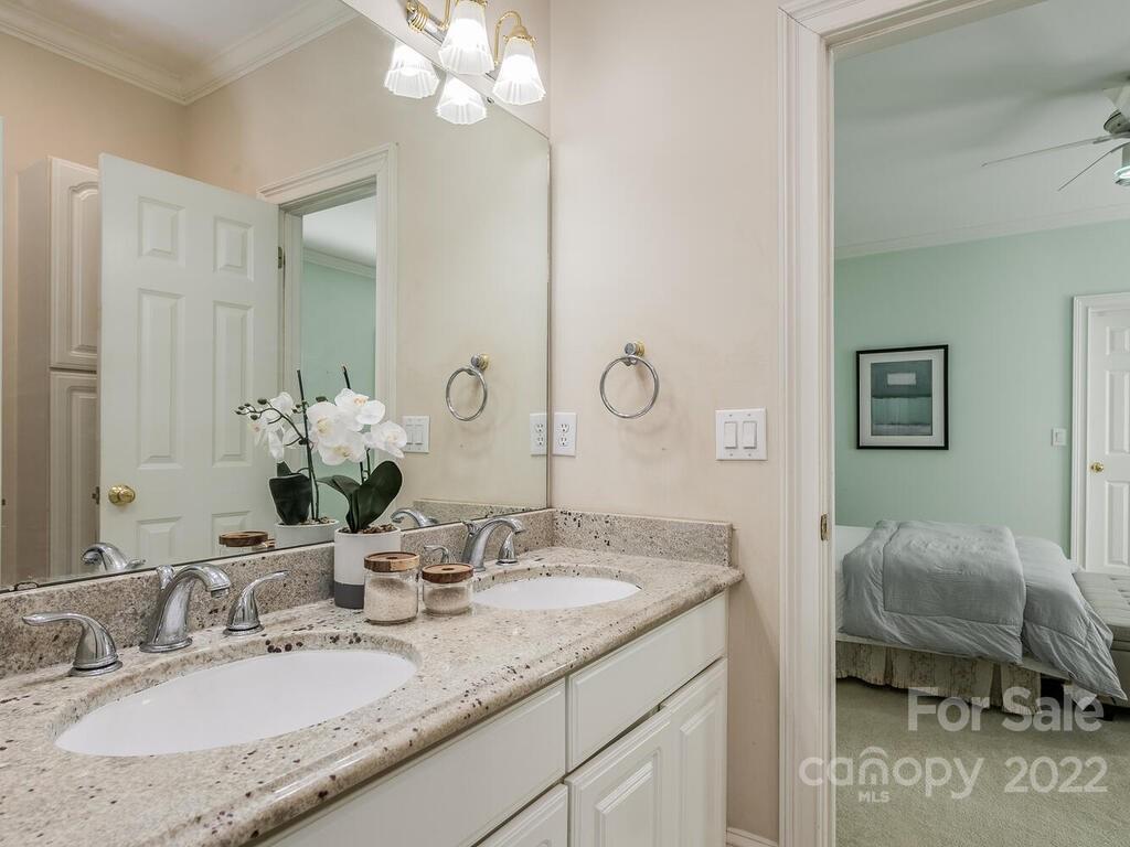 4101 High Ridge Road Charlotte, NC 28270 - Photo 21 of 38 a en suite bathroom with a granite countertop double vanity sink and a mirror