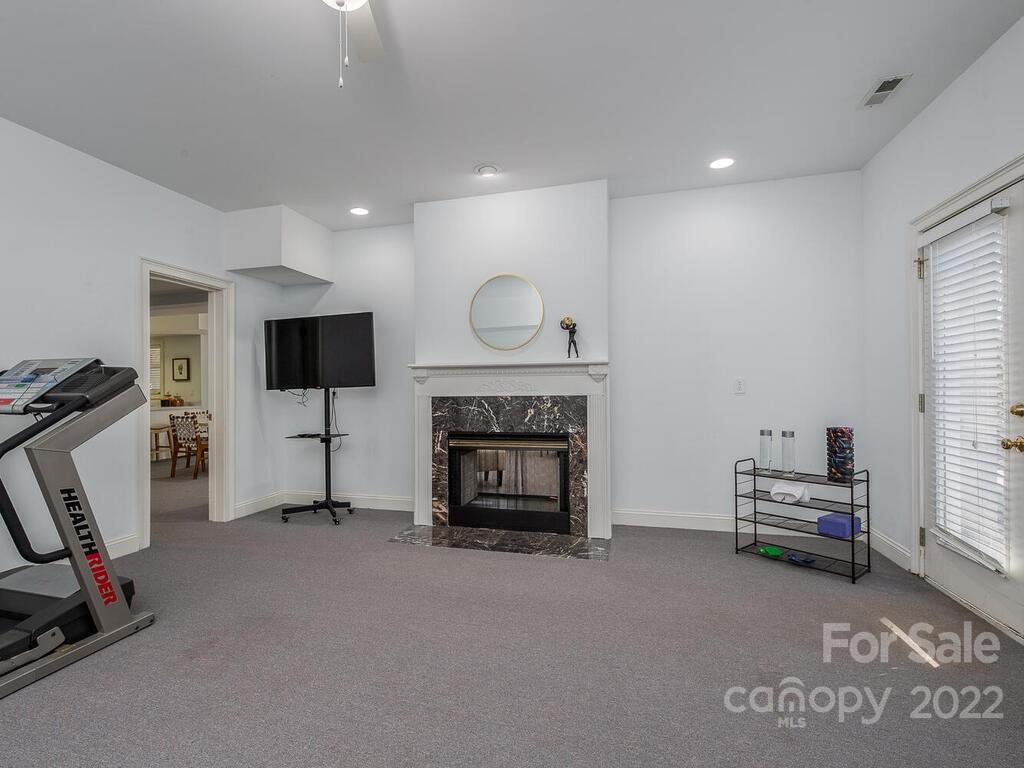 4101 High Ridge Road Charlotte, NC 28270 - Photo 24 of 38 a living room with furniture and a fireplace