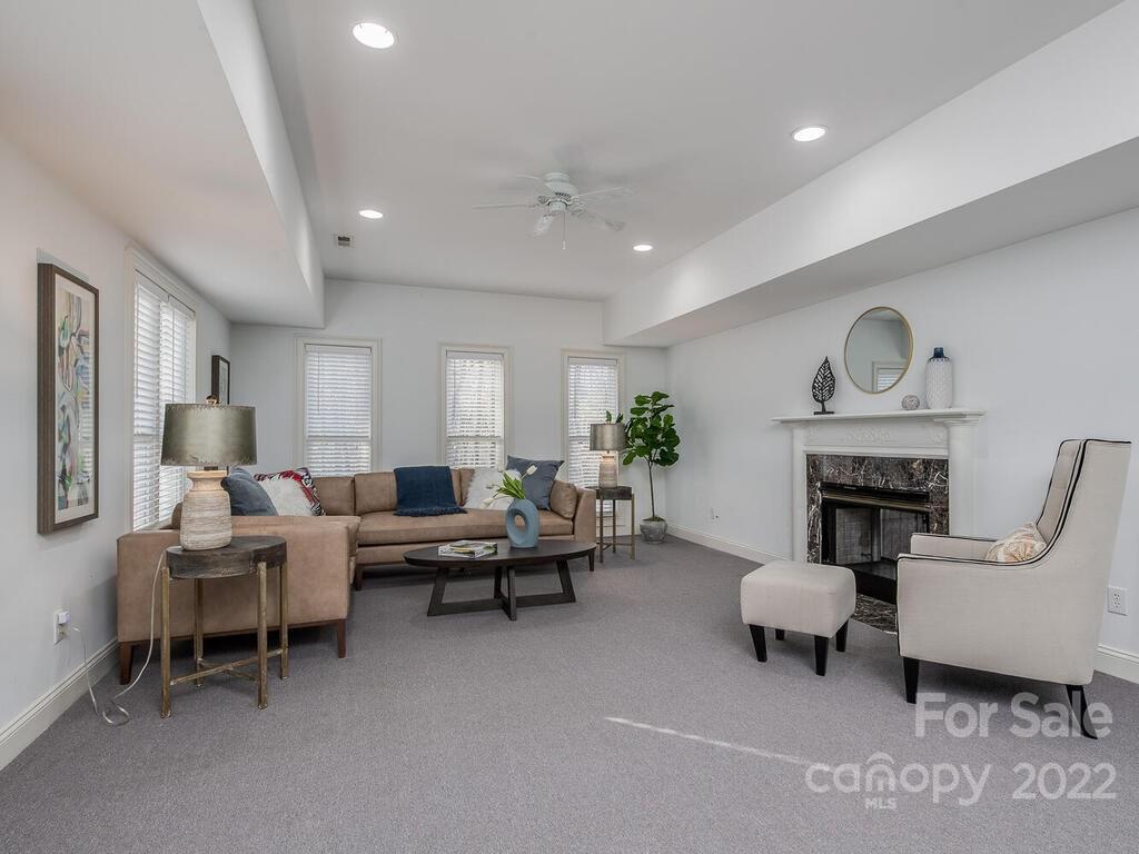 4101 High Ridge Road Charlotte, NC 28270 - Photo 26 of 38 a living room with furniture and a fireplace