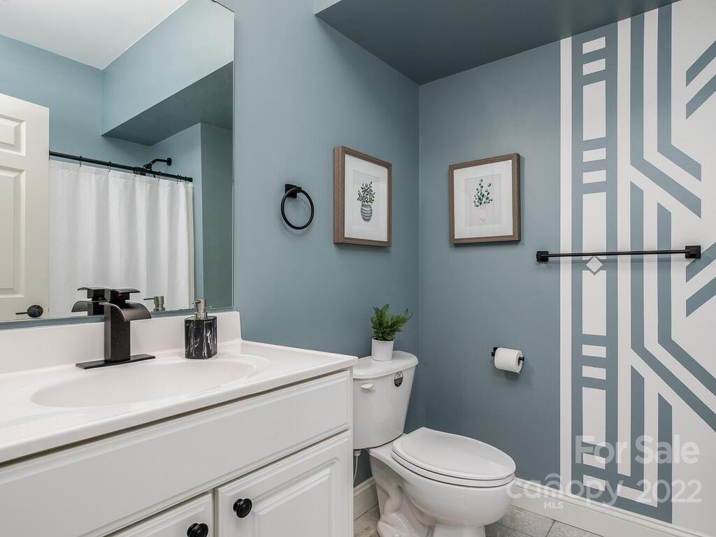 4101 High Ridge Road Charlotte, NC 28270 - Photo 31 of 38 a bathroom with a sink toilet and a mirror
