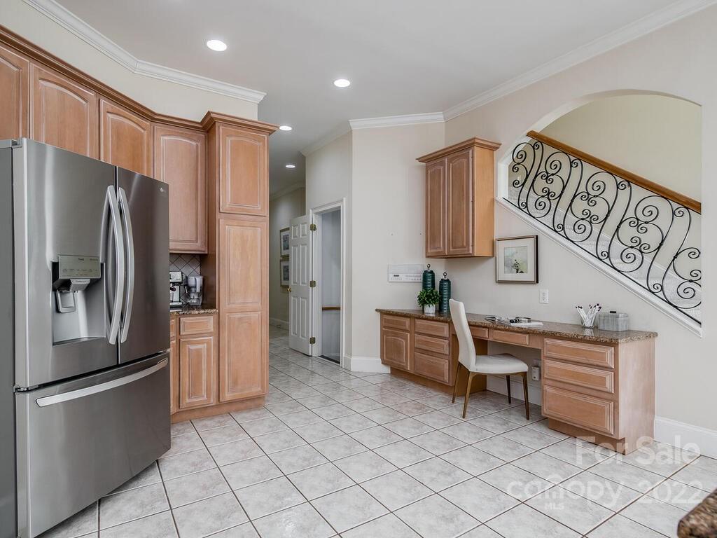 4101 High Ridge Road Charlotte, NC 28270 - Photo 7 of 38 a kitchen with stainless steel appliances a refrigerator and a stove top oven