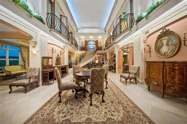 a living room with fireplace furniture and a large window