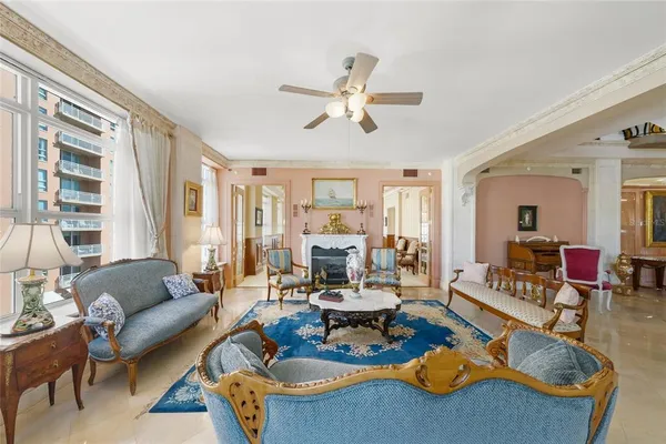 a bedroom with a bed couch and window