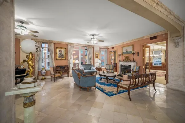 a living room with furniture rug and a large window