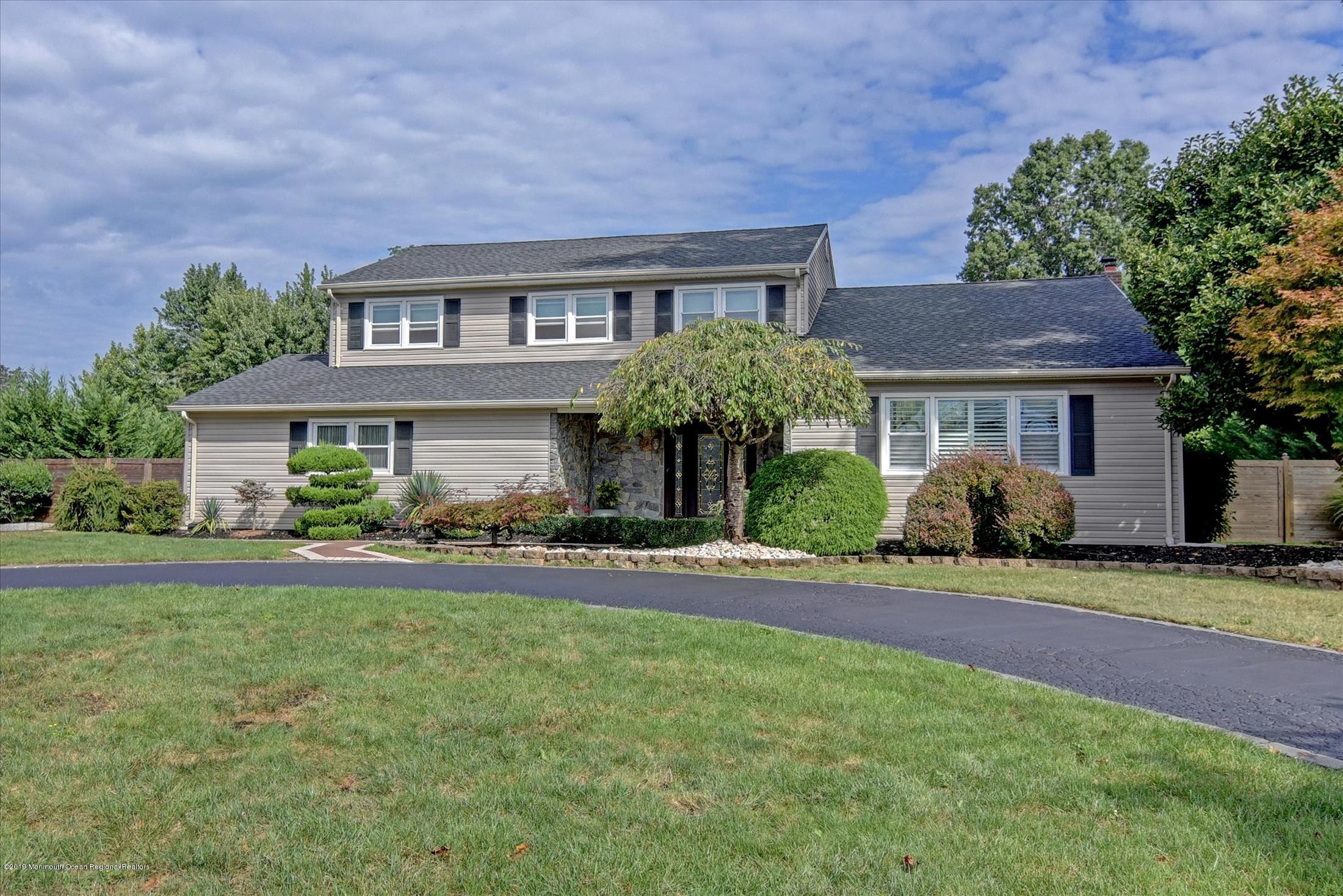 244 Elton Adelphia Road Freehold, NJ 07728 - Photo 1 of 46 a front view of a house with a yard and porch