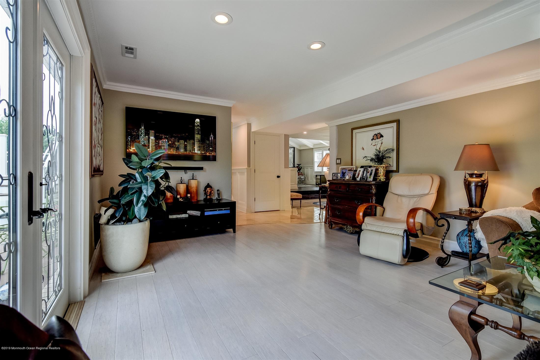 244 Elton Adelphia Road Freehold, NJ 07728 - Photo 16 of 46 a room with furniture and a flat screen tv