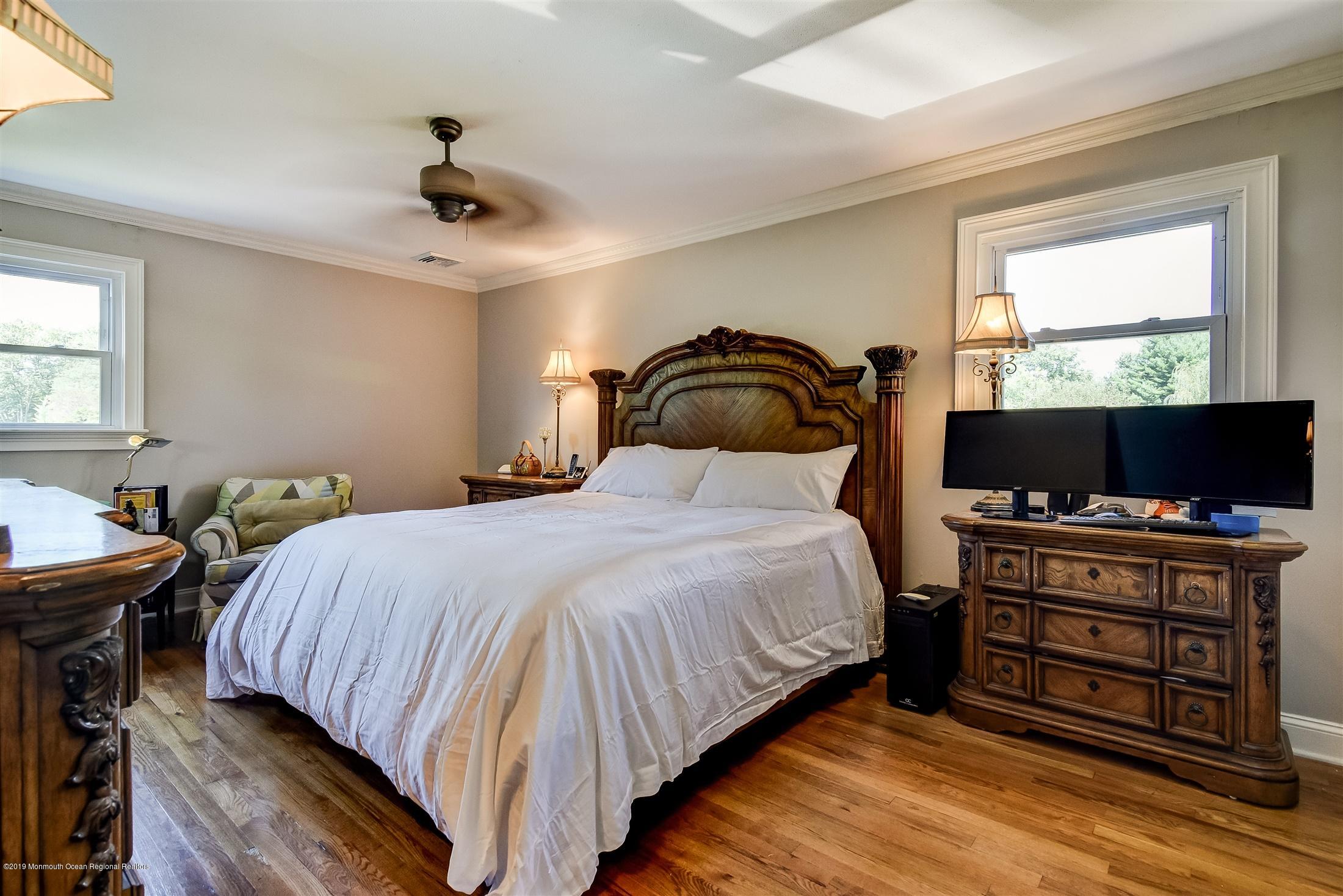 244 Elton Adelphia Road Freehold, NJ 07728 - Photo 17 of 46 a bedroom with a bed and a flat screen tv