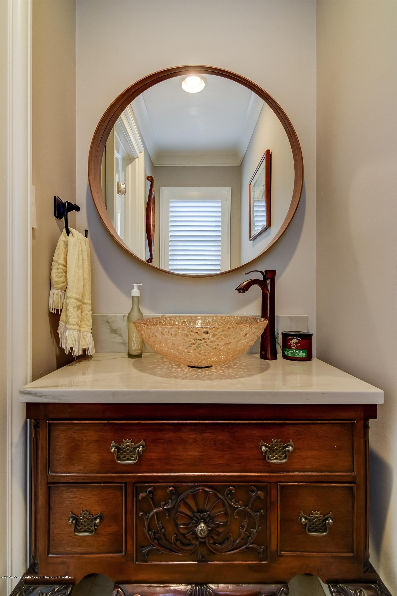 244 Elton Adelphia Road Freehold, NJ 07728 - Photo 26 of 46 a view of mirror and cabinets