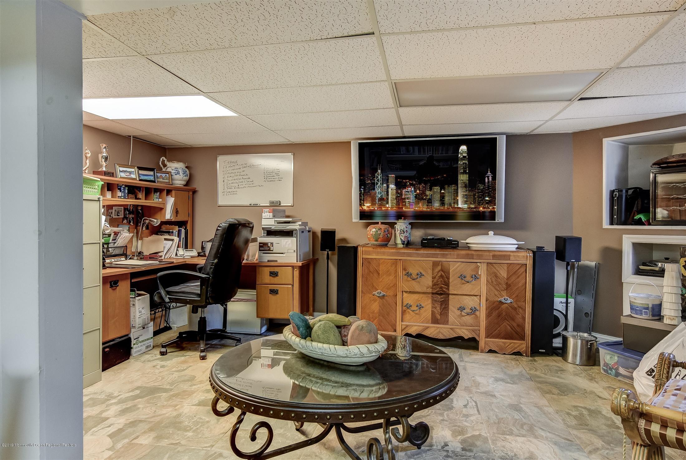 244 Elton Adelphia Road Freehold, NJ 07728 - Photo 27 of 46 a room with furniture and musical instruments