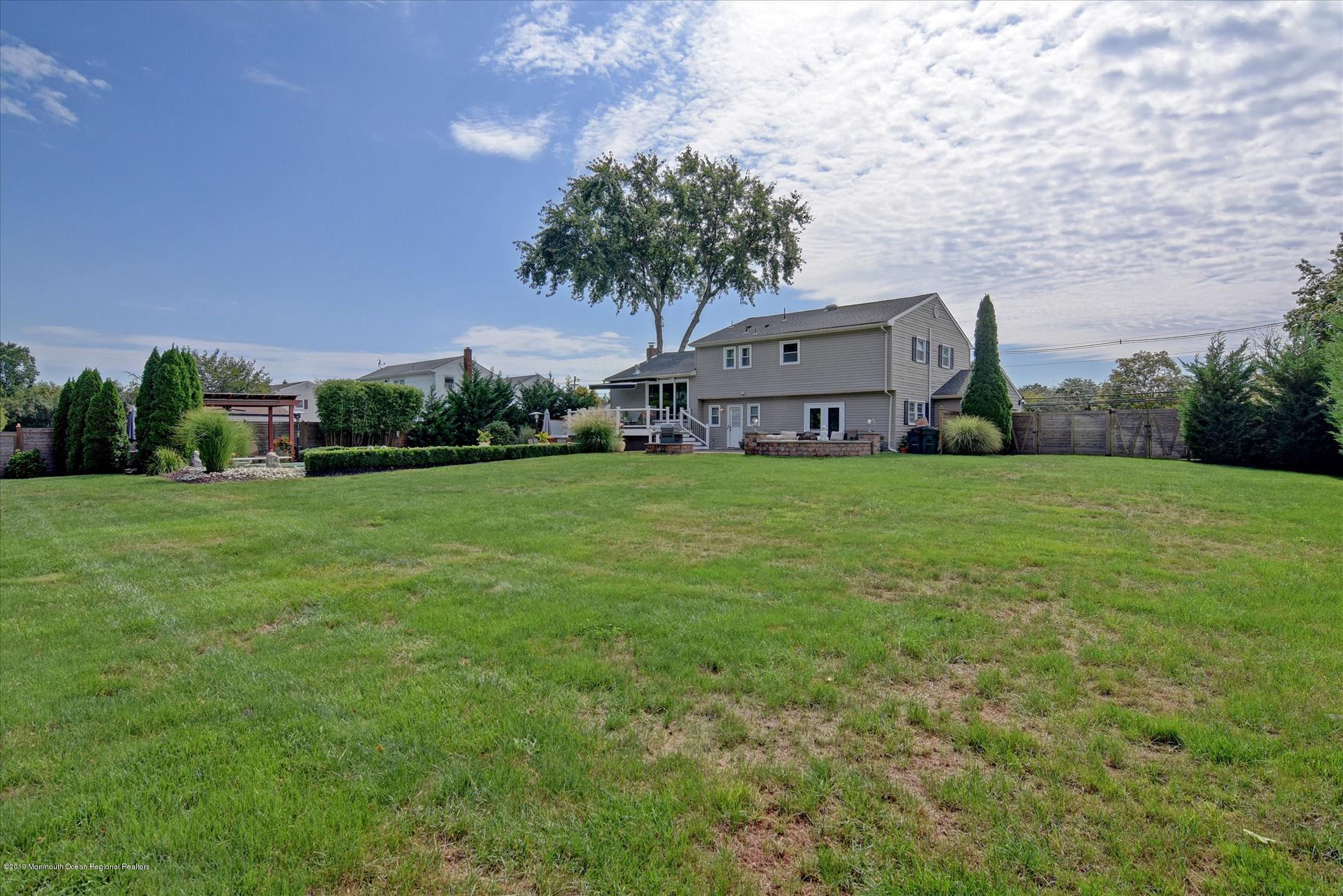 244 Elton Adelphia Road Freehold, NJ 07728 - Photo 30 of 46 a view of a house with a yard and a garage