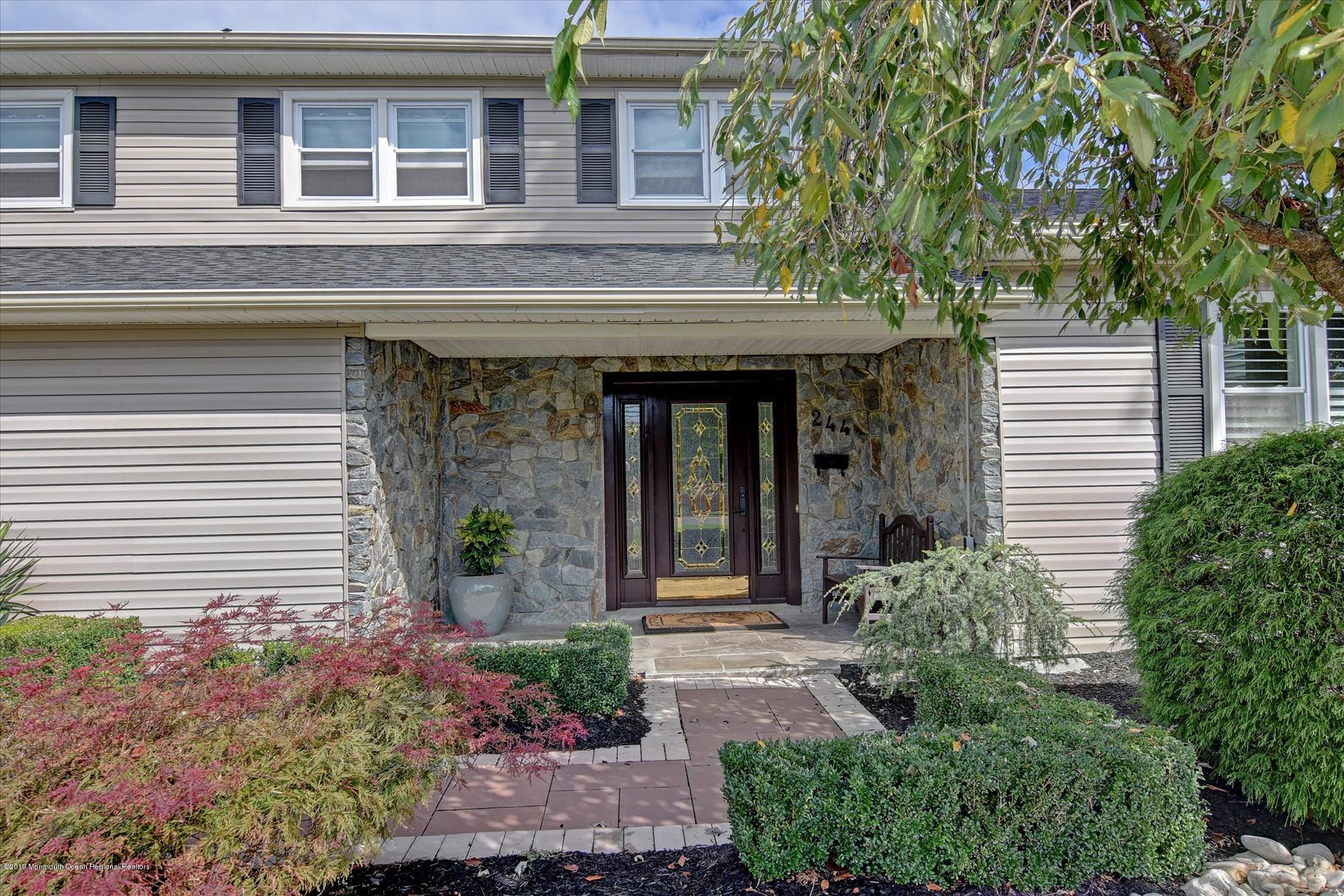 244 Elton Adelphia Road Freehold, NJ 07728 - Photo 3 of 46 front view of a house with potted plants