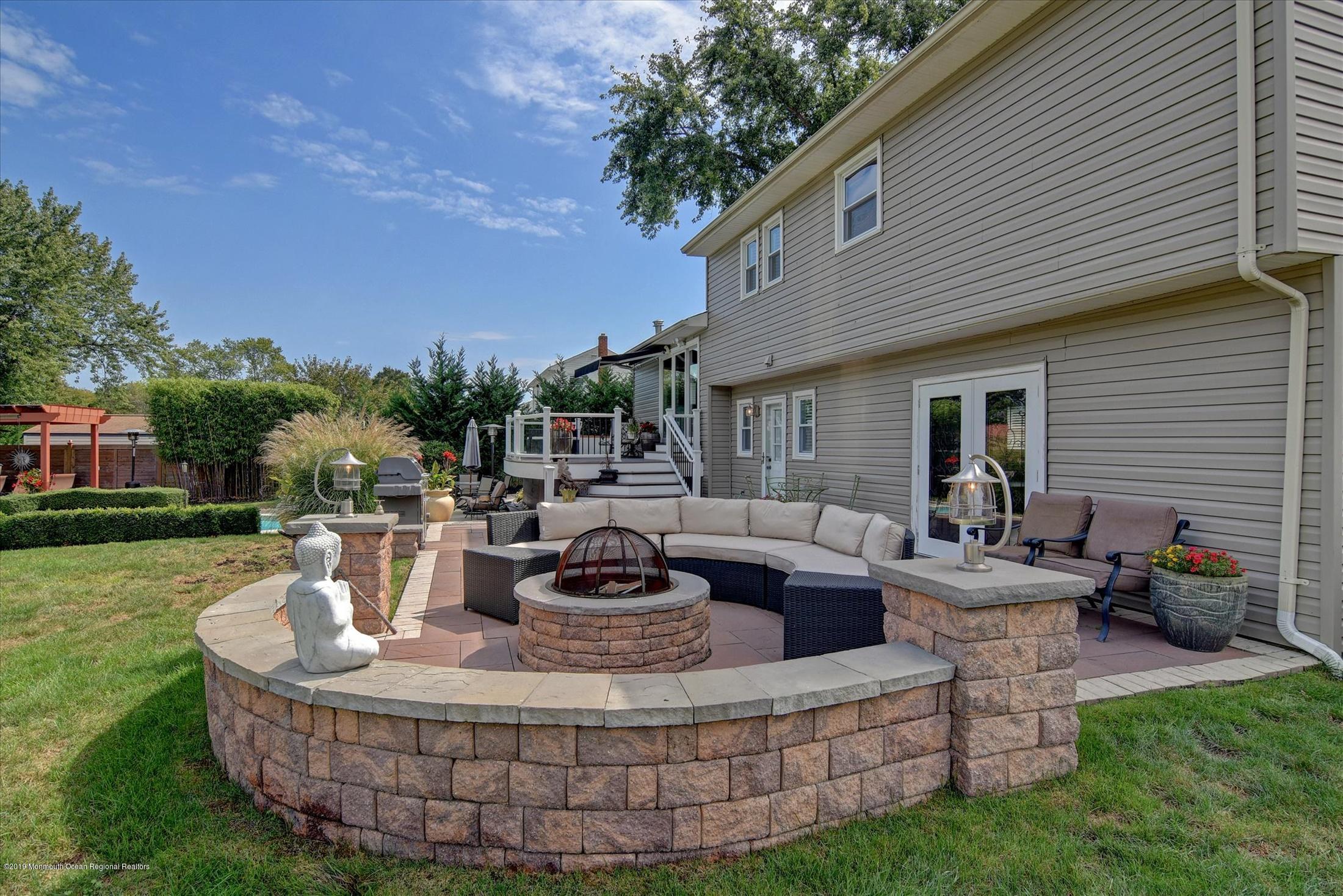 244 Elton Adelphia Road Freehold, NJ 07728 - Photo 31 of 46 a view of a house with backyard and sitting area