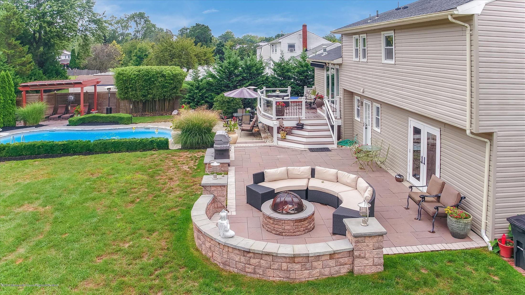 244 Elton Adelphia Road Freehold, NJ 07728 - Photo 33 of 46 a view of a house with backyard sitting area and furniture