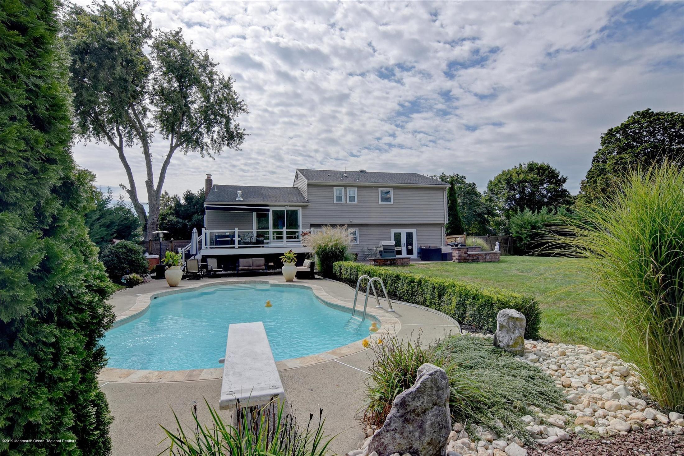 244 Elton Adelphia Road Freehold, NJ 07728 - Photo 38 of 46 a front view of a house with garden