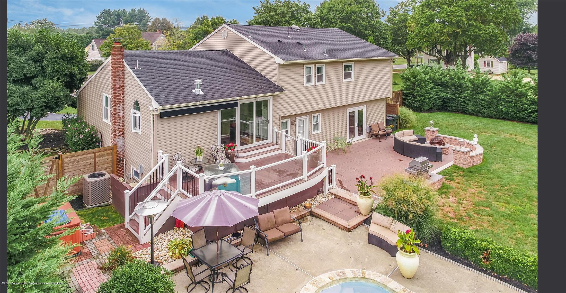 244 Elton Adelphia Road Freehold, NJ 07728 - Photo 42 of 46 an aerial view of a house with swimming pool and garden