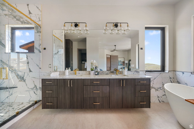10646 North Reflection Ridge Hideout, UT 84036 - Photo 31 of 43 Spacious bathroom featuring a dual vanity with dark wood-finish cabinetry and light-toned countertops