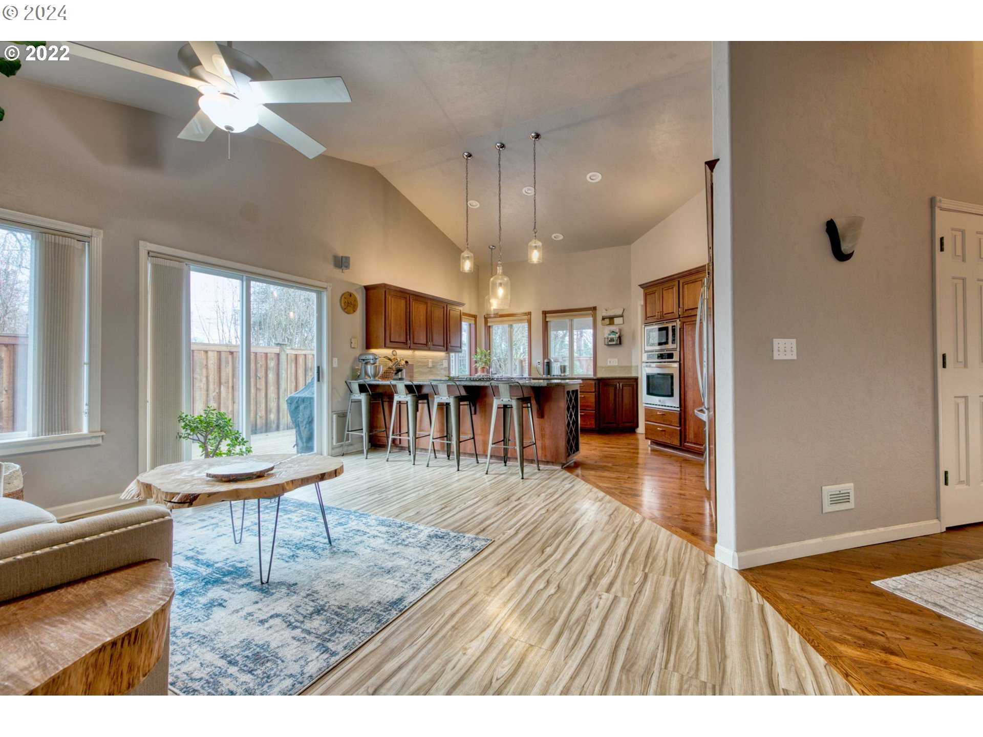 1425 Gilham Road Eugene, OR 97401 - Photo 12 of 30 a living room with furniture and a wooden floor