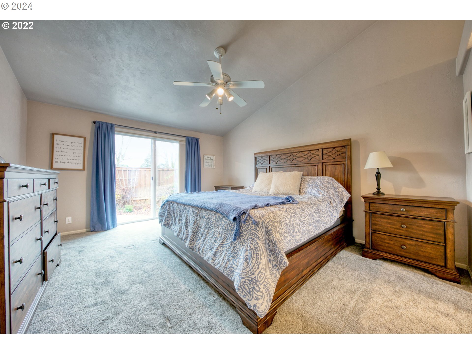 1425 Gilham Road Eugene, OR 97401 - Photo 18 of 30 a bedroom with a bed and a chandelier