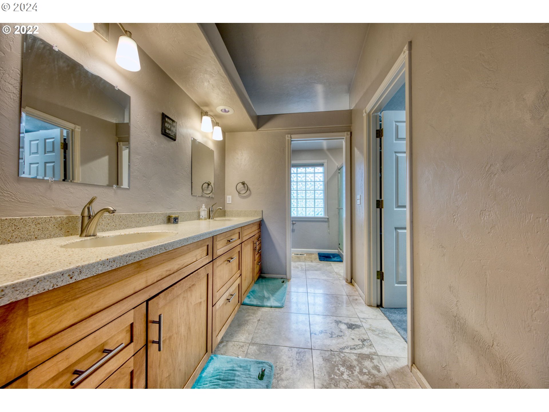 1425 Gilham Road Eugene, OR 97401 - Photo 20 of 30 a spacious bathroom with a double vanity sink and a mirror