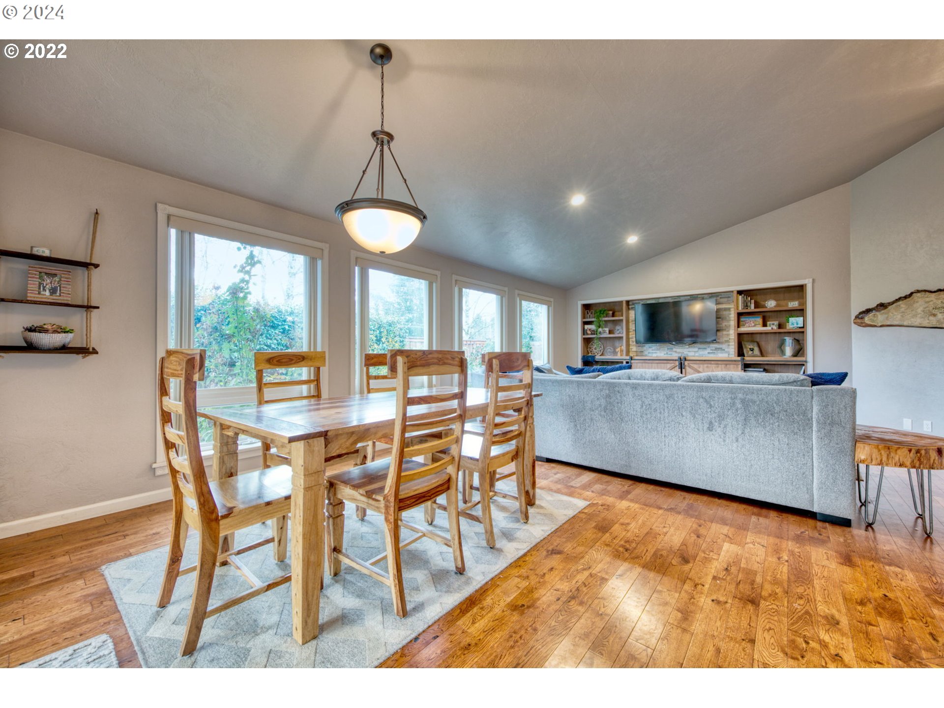 1425 Gilham Road Eugene, OR 97401 - Photo 2 of 30 a view of a dining room with furniture window and wooden floor