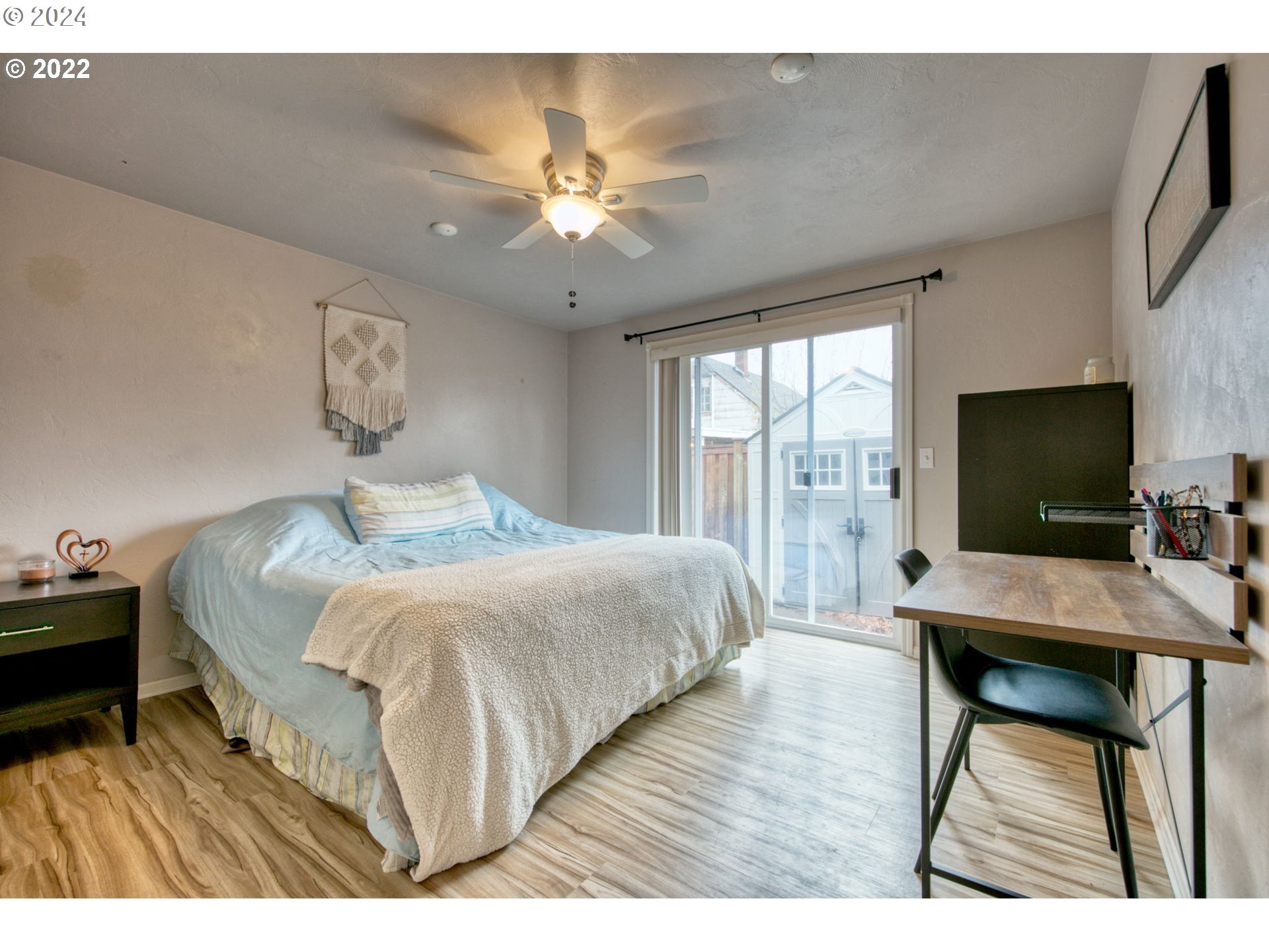 1425 Gilham Road Eugene, OR 97401 - Photo 28 of 30 a bedroom with a bed and a flat screen tv