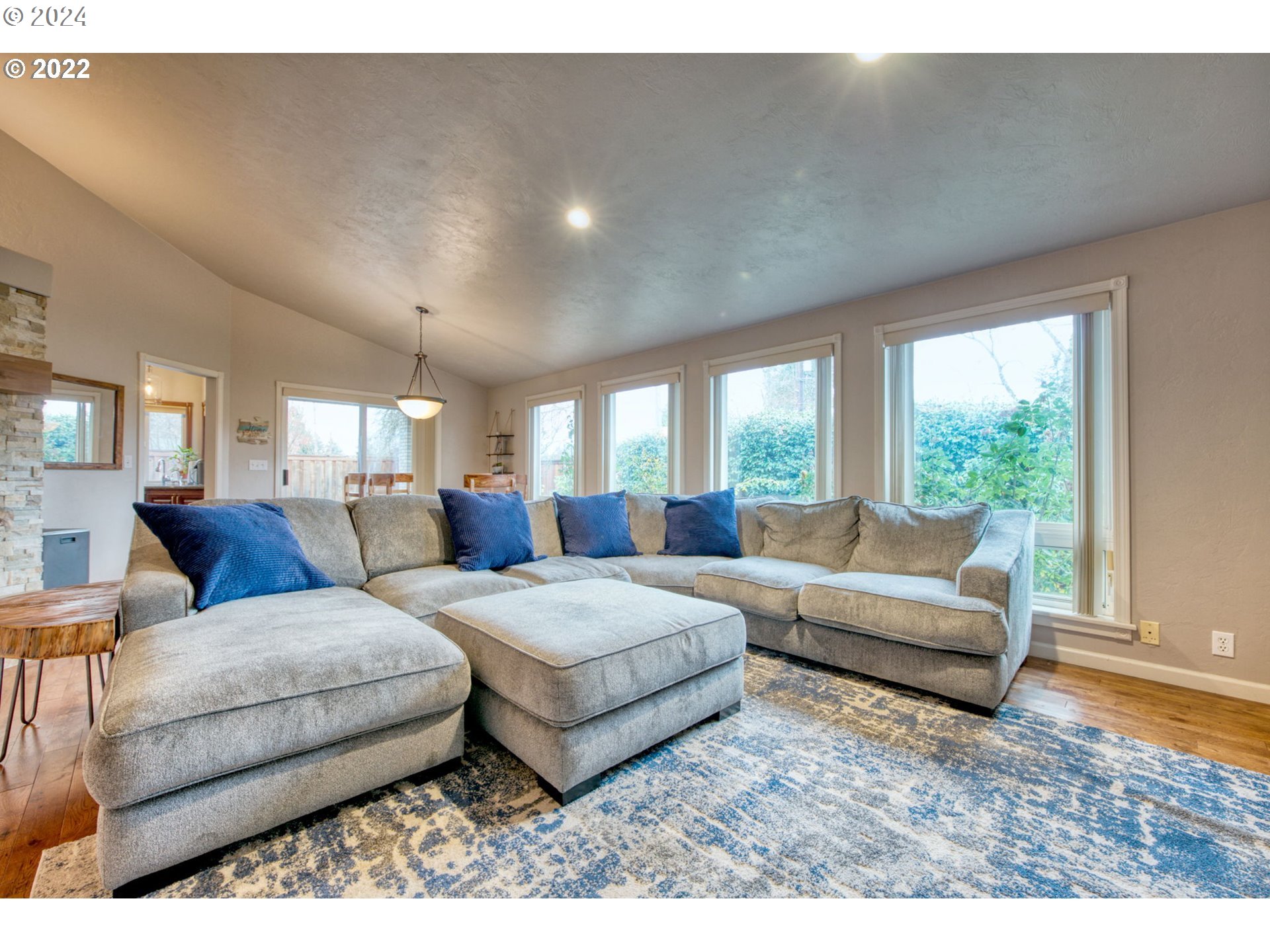 1425 Gilham Road Eugene, OR 97401 - Photo 4 of 30 a living room with furniture and a large window