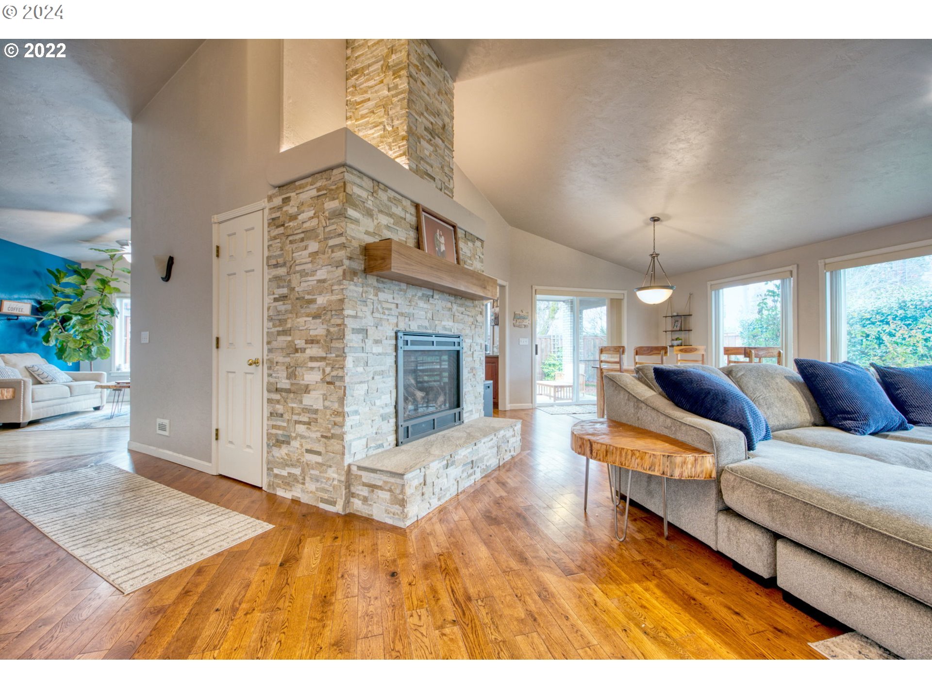 1425 Gilham Road Eugene, OR 97401 - Photo 5 of 30 a living room with furniture and a fireplace