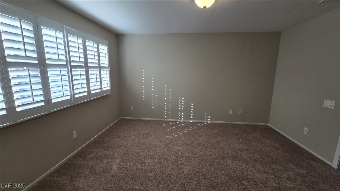 2737 Rimbaud Street Henderson, NV 89044 - Photo 38 of 49 Empty room featuring carpet and baseboards