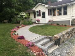 67 Fritz Road Colebrook, CT 06021 - Photo 1 of 1 a front view of a house with a yard and garage