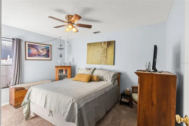 a bathroom with a sink a mirror a toilet and shower