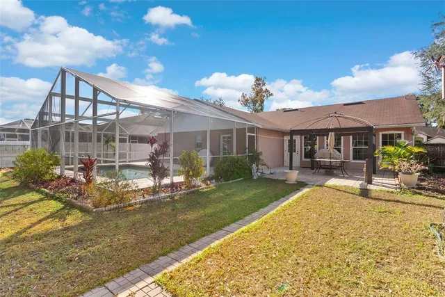a view of a livingroom with furniture and a workspace