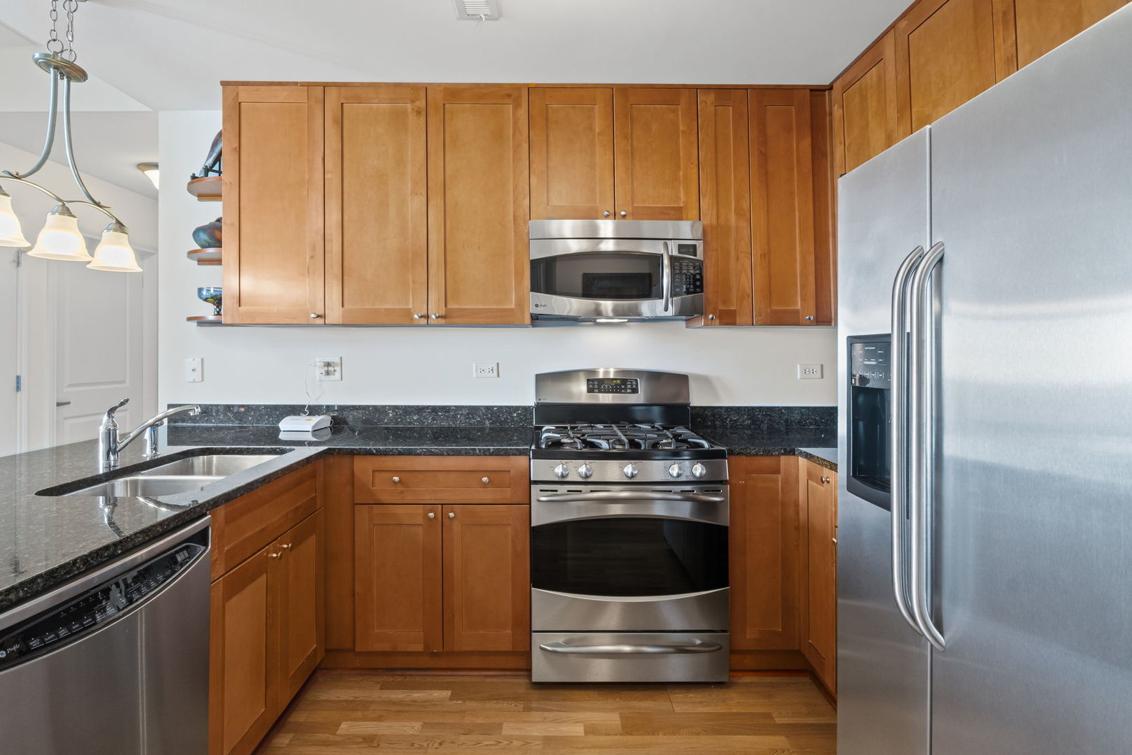 1199 East Port Clinton Road, Unit 601 Vernon Hills, IL 60061 - Photo 2 of 13 a kitchen with stainless steel appliances granite countertop a stove a refrigerator and a sink