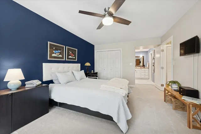 a spacious bathroom with a granite countertop sink mirror and a toilet